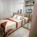 Small bedroom with storage solutions and cozy decor