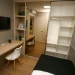 Compact storage units and shelves in a small living room