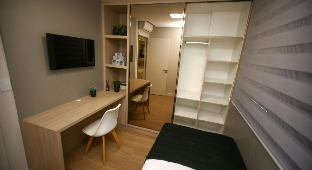Compact storage units and shelves in a small living room
