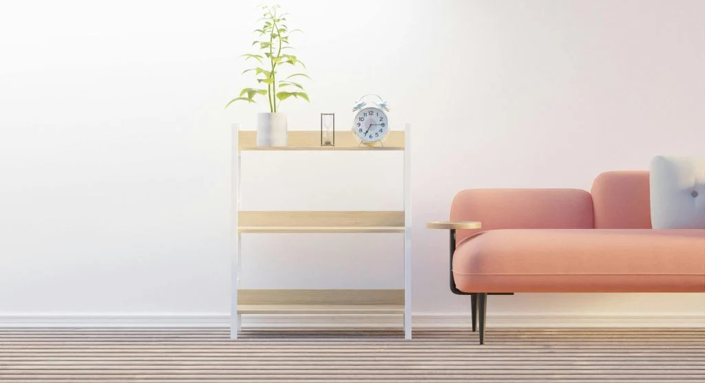 Person decluttering a room by sorting items into boxes