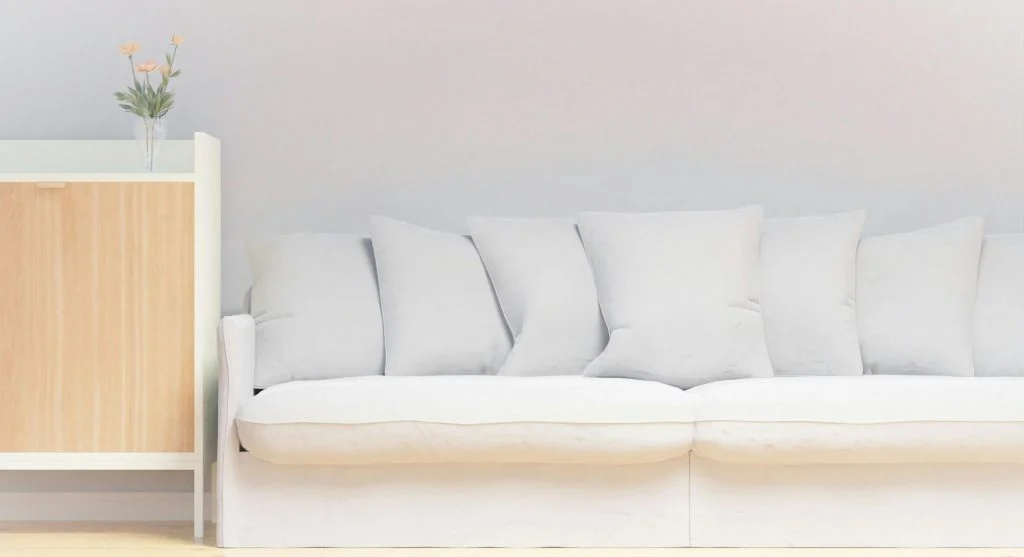 Living room with matching furniture and decor in a uniform color palette
