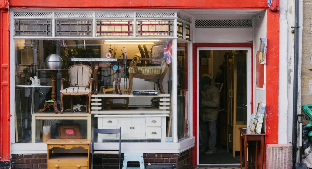 A beautifully decorated room with a mix of vintage and modern furniture
