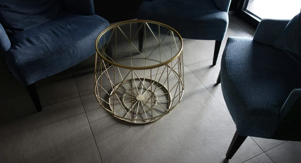 Living room with sofa and coffee table arranged around a focal point