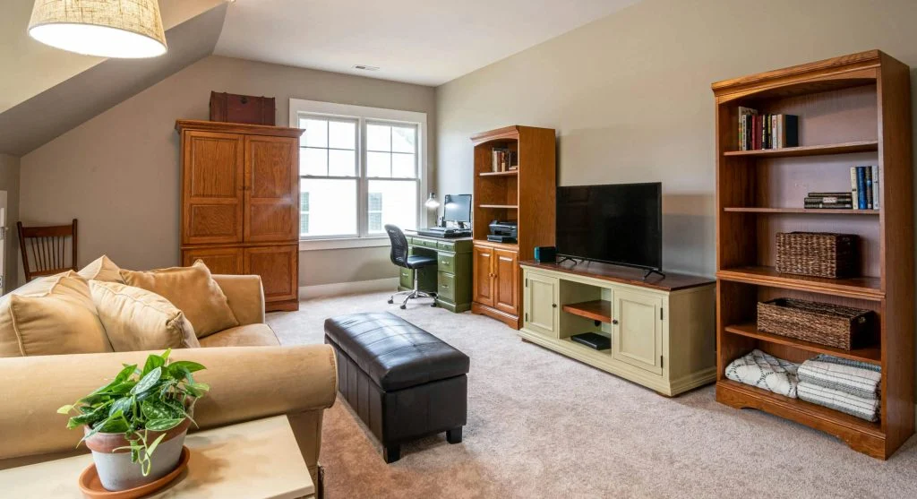 Small space living room with vertical storage shelves and cabinets