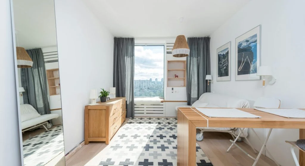 Small space living room with mirrors to create illusion of larger space
