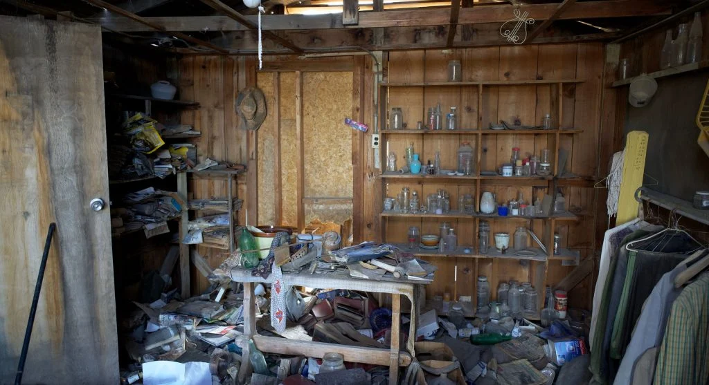 cluttered room with too much furniture